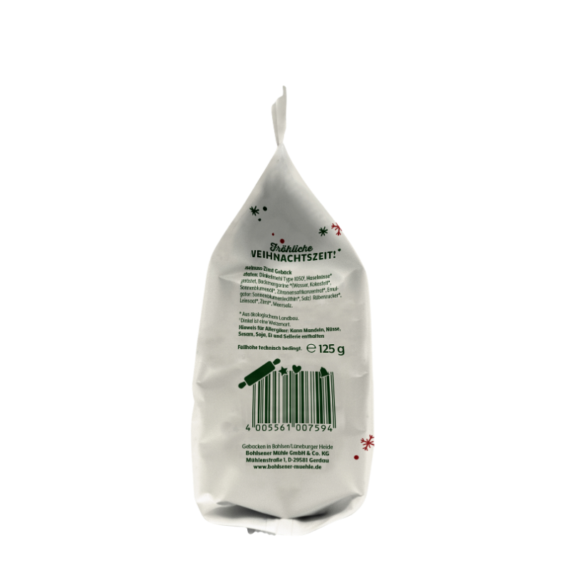 Rückseite der Bohlsener Mühle Haselnuss-Zimt-Gebäck Tüte mit Zutatenliste und Barcode auf weißem Hintergrund.