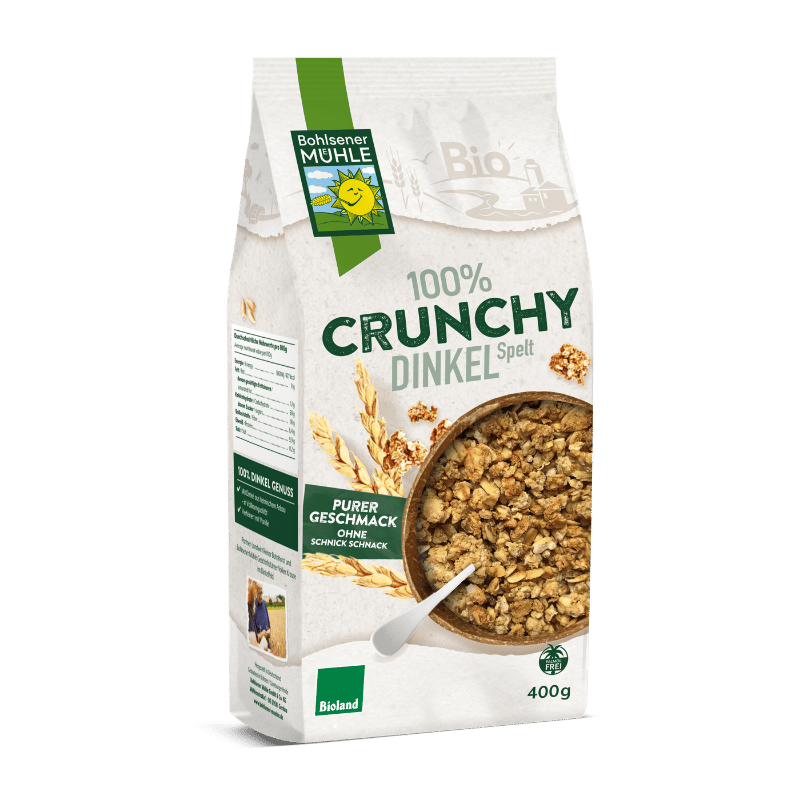 Verpackung von Bohlsener Mühle 100% Crunchy Dinkel mit Müsli und Löffel.