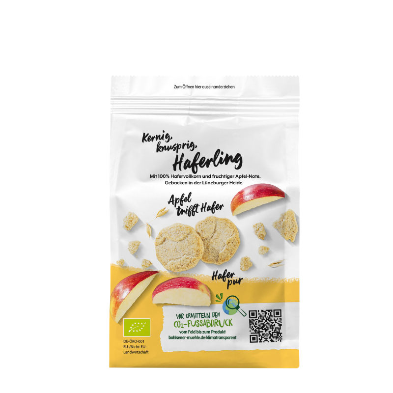 Bohlsener Mühle Haferling Cookie mit Apfelstücken und Haferflocken auf weißer Verpackung mit gelbem Rand.