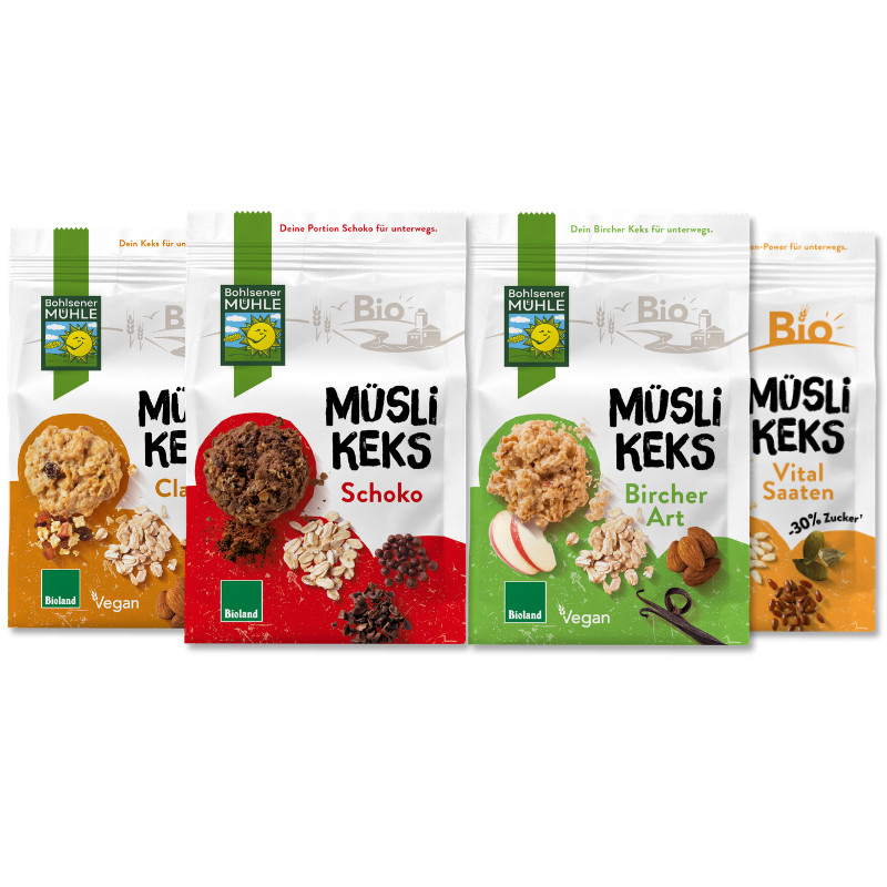 Vier Packungen Müsli Keks von Bohlsener Mühle mit verschiedenen Zutaten wie Schoko, Bircher Art und Vital Saaten.