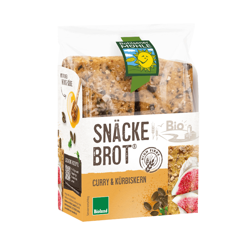 Bohlsener Mühle Snäckebrot Curry & Kürbiskern in der transparenten Verpackung mit sichtbarem, knusprigem Knäckebrot.