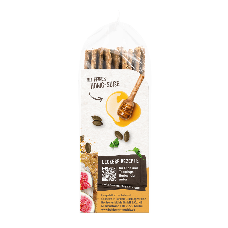 Bohlsener Mühle Honig-Süße Knäckebrot in transparenter Packung mit Honig, Kürbiskernen und frischen Feigen abgebildet.