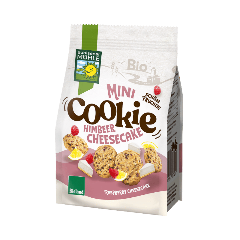 Bohlsener Mühle Mini Cookie Himbeer Cheesecake in der Verpackung mit Keksen und Himbeeren.