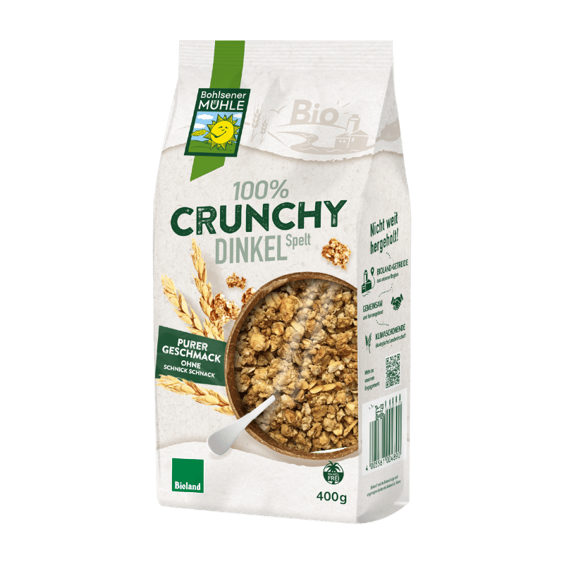 Bohlsener Mühle 100% Crunchy Dinkel in einer Verpackung mit Schüssel und Löffel.
