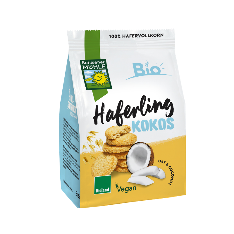 Eine Packung Haferling Kokos von Bohlsener Mühle mit abgebildeten Hafer-Keksen und frischen Kokosnussstücken.