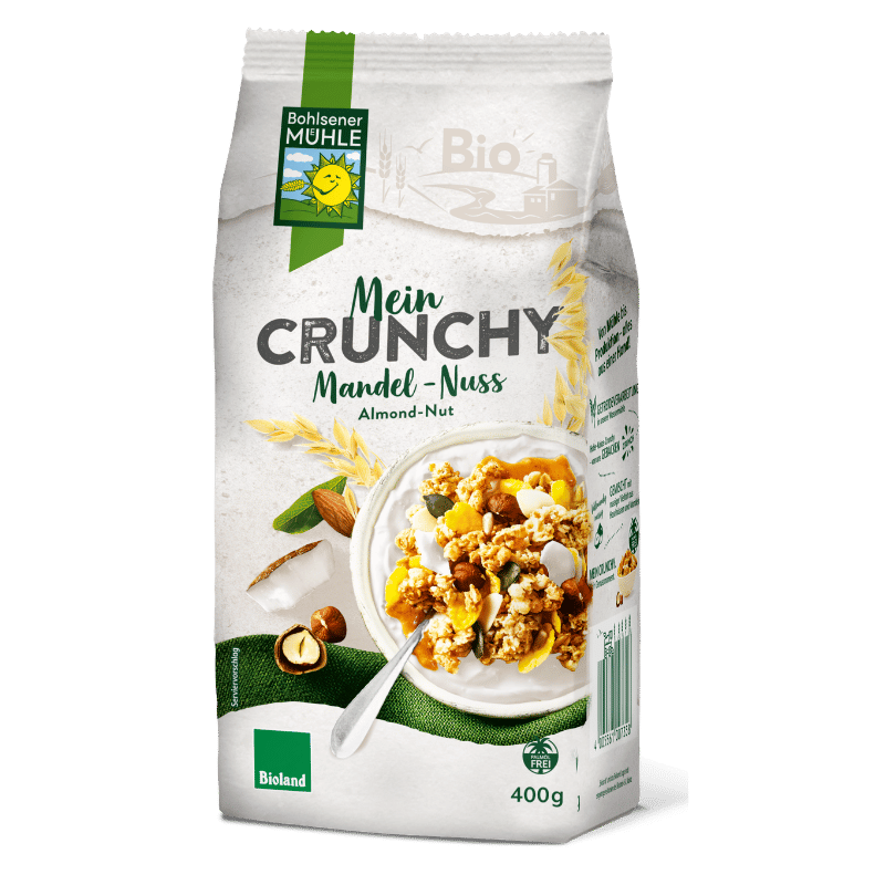 Bohlsener Mühle Mein Crunchy Mandel-Nuss in einer Schüssel mit Nüssen und Flocken.