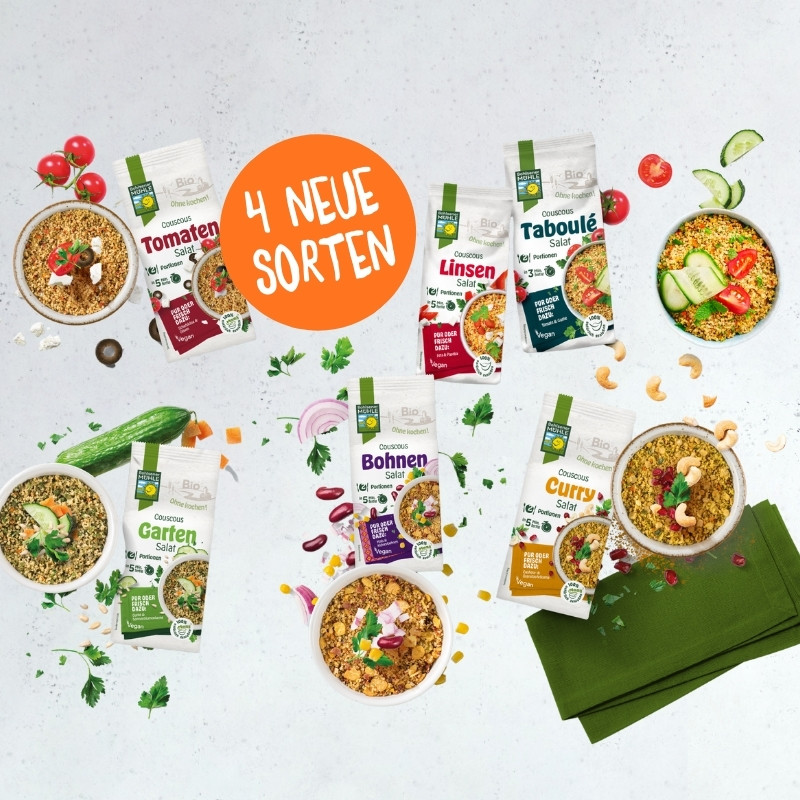 Verschiedene Couscous Salate von Bohlsener Mühle in Schalen und Verpackungen.
