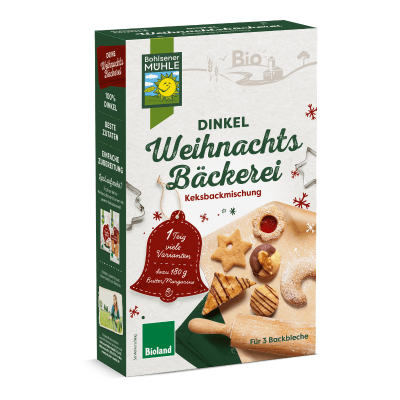 Die Bohlsener Mühle Dinkel Weihnachtsbäckerei Keksbackmischung mit verschiedenen gebackenen Keksen und Nudelholz.